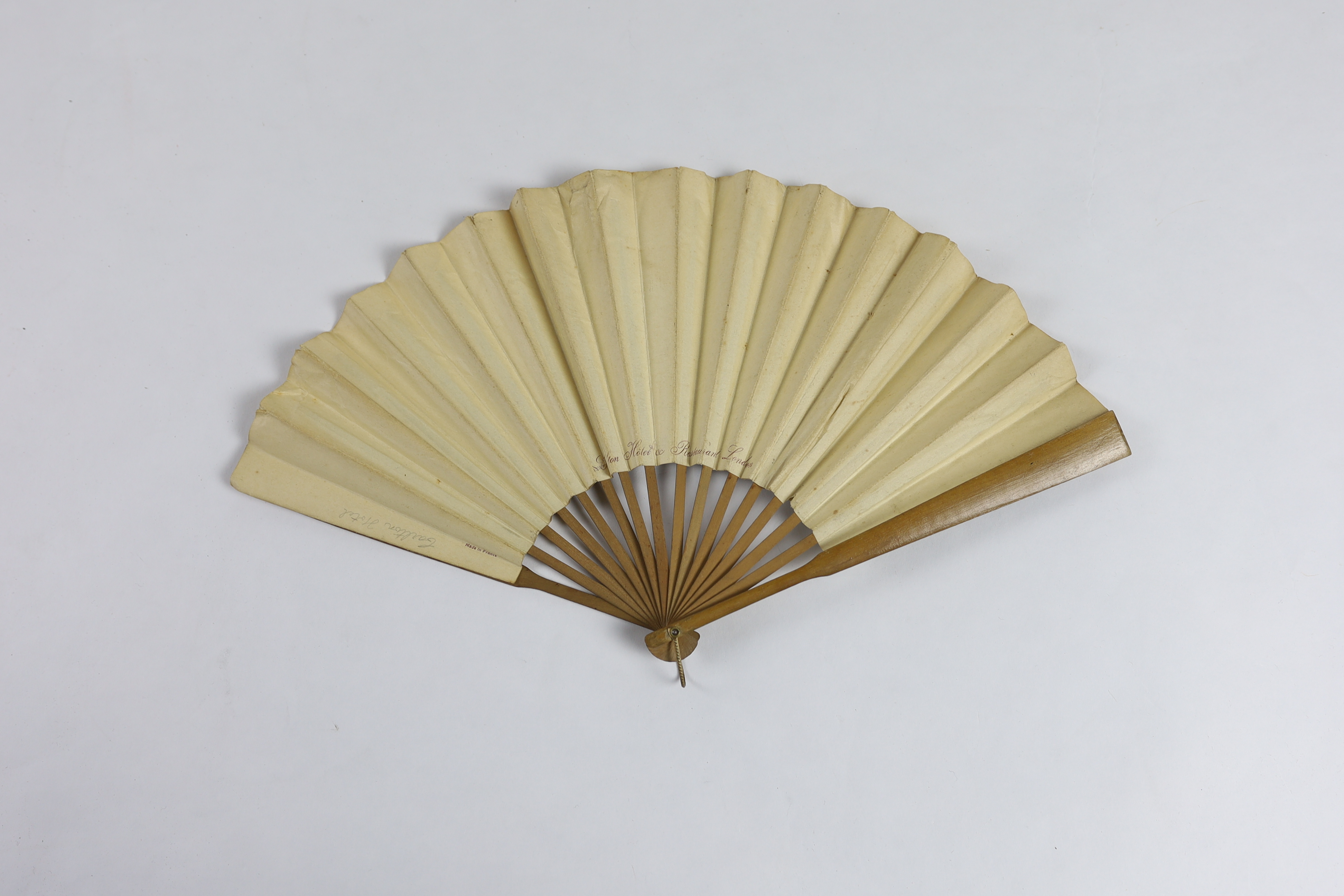 An unusual late 19th / early 20th century paper advertising fan for The Carlton Hotel, London (as printed on the back of fan leaf), signed on the front Georges Reson